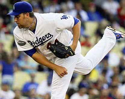 Aaron Harang snaps his three-game losing streak by throwing seven innings of three-hit ball against the Reds. (AP)