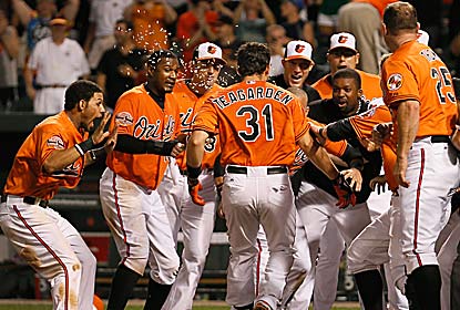Taylor Teagarden returns from the DL to be the O's hero with a two-run homer in the 13th. (Getty Images)