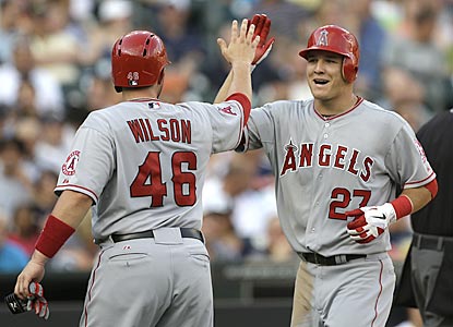 Mike Trout (27) is congratulated by Bobby Wilson after hitting a two-run shot in the second inning. (AP)