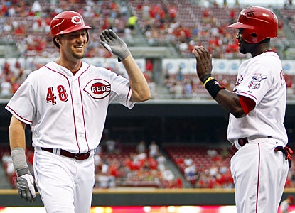 Ryan Ludwick (left) helps get Cincinnati off to a fast 4-0 lead with a three-run roundtripper in the first inning.   (US Presswire)
