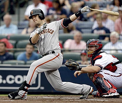 Buster Posey follows through on a double in the first inning that opens the scoring.  (AP)
