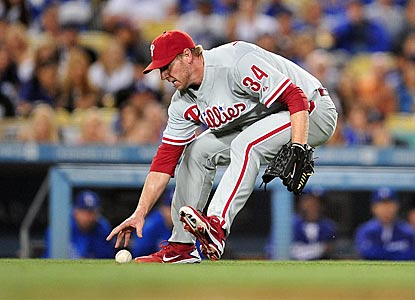 Roy Halladay makes a fielding error in the fifth inning, but pitches out of it and gives Philadelphia a chance to win.  (US Presswire)