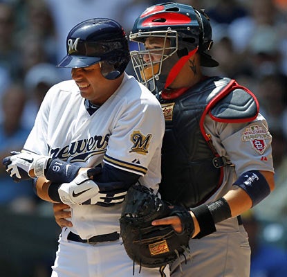 Aramis Ramirez avoids a potential injury after getting hit by a pitch in the elbow. He finishes the game 3 for 3. (AP)