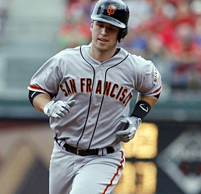Buster Posey rounds the bases after his two-run homer, one of his four hits against the Phillies.  (AP)