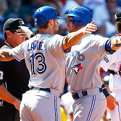 Brett Lawrie (left) and J.P. Arencibia hit two of the Blue Jays' four home runs in their victory over the Red Sox.  (Getty Images)
