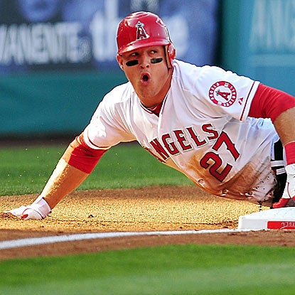 The Angels' Mike Trout scores a run in his 14th consecutive game to set an American League rookie record.  (US Presswire)