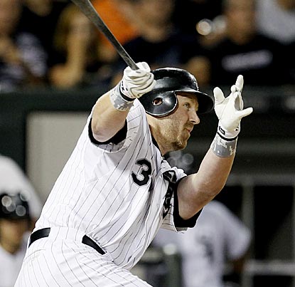 Adam Dunn connects for his 30th home run of the season, the ninth time he has achieved that mark in his career. (AP)