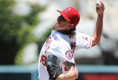 Jered Weaver strikes out eight over five innings, giving up only Billy Butler's two run homer. (Getty Images)
