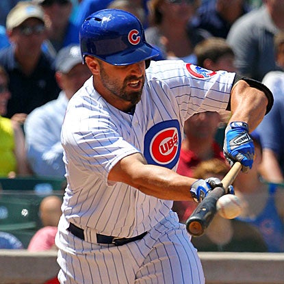 Pinch hitter Reed Johnson lays down a bunt single in the seventh inning to drive in the Cubs' go-ahead run.  (US Presswire)