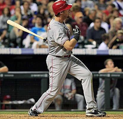 Ryan Ludwick watches the path of the ball, his leadoff, solo home run in the eighth inning. (AP)