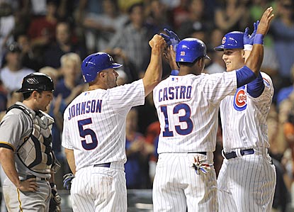 Reed Johnson (5) congratulates Anthony Rizzo (right) on his three-run blast in the fifth inning shortly before getting traded.  (AP)