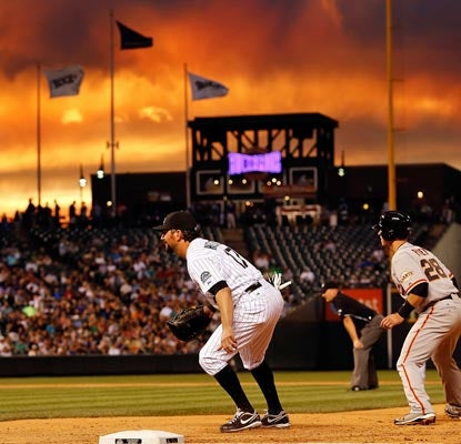 Rockies fans get to see a beautiful sunset, but the game itself is nothing but ugly for the home team.  (Getty Images)