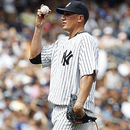 The Yankees' Freddy Garcia allows two runs in five innings of work to earn the win vs. the Mariners, the 150th of his career.  (US Presswire)