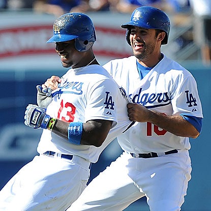 Hanley Ramirez (left) gets congratulations from teammate Andre Ethier after driving in the Dodgers' winning run. (Getty Images)