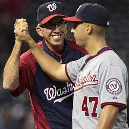 Nationals manager Davey Johnson congratulates Gio Gonzalez on his first career complete game.  (Getty Images)
