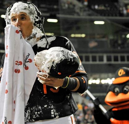 Welcome to the big leagues, Manny Machado. The rookie gets a shaving cream pie to the face after his two-homer game.  (AP)