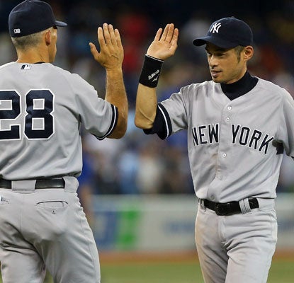 Ichiro Suzuki (right), starting in center field, matches a career-high in RBI he set nearly eight years ago.  (AP)