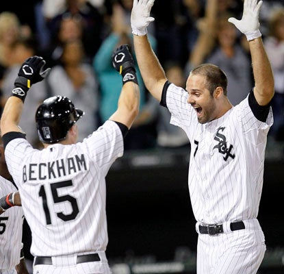 Jordan Danks (right) wins it for the White Sox, who keep their one-game lead in the AL Central over Detroit.  (AP)