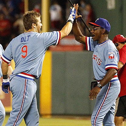Rangers manager Ron Washington congratulates Mike Olt, who was called up from Double-A on Aug. 1, on his game winner. (Getty Images)