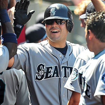 Jesus Montero connects for two homers off the Angels' Jered Weaver, the major league ERA leader, to help lift the M's. (US Presswire)