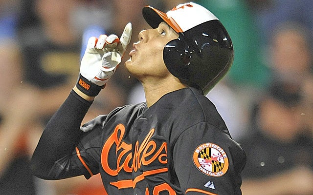 Manny Machado celebrates the first of two home runs in his second big league start. (AP)
