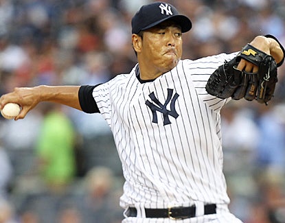 Hiroki Kuroda strikes out five Rangers, bringing his strikeout total to 14 for August. (AP)