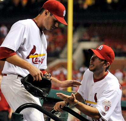 Cardinals rookie Joe Kelly (left) is congratulated by Adam Wainwright after holding down the D-Backs through 6 1/3 innings.  (Getty Images)