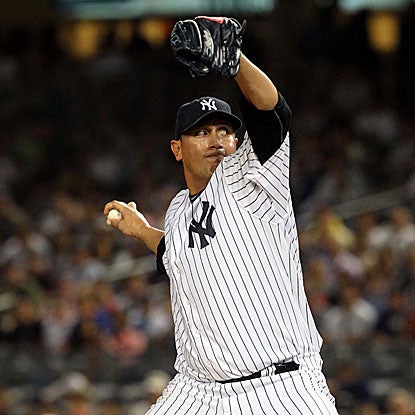 The Yankees' Freddy Garcia allows just two solo homers to Josh Hamilton in 6 2/3 innings to defeat the Rangers. (Getty Images)