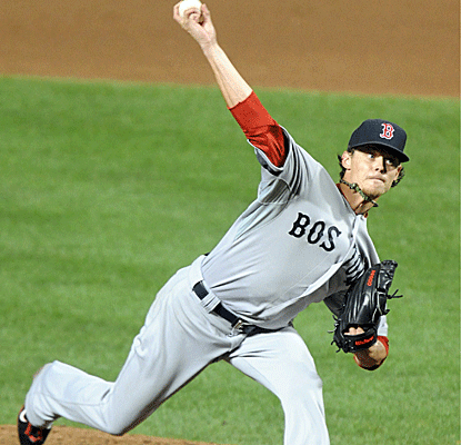Clay Buchholz strikes out seven, scattering eight hits over eight innings to earn his 11th win of the year.  (Getty Images)