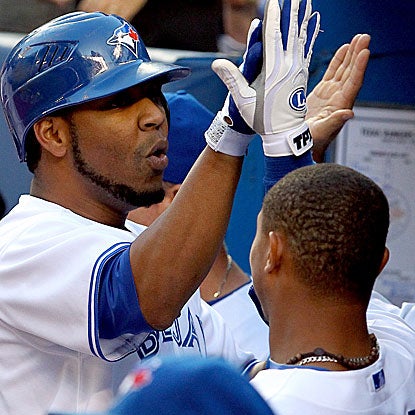 Edwin Encarnacion returns to the lineup after missing one game and homers to help the Blue Jays edge the Rangers. (Getty Images)
