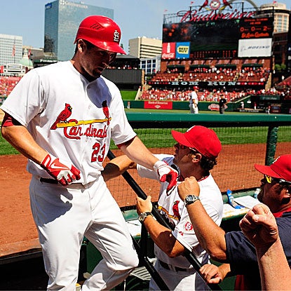 David Freese is welcomed back to the Cardinals' dugout after cracking a three-run homer in their win vs. the Astros. (Getty Images)