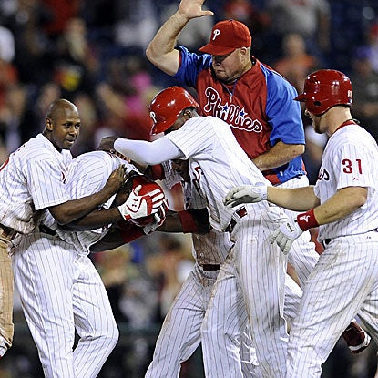 The Phillies get past the Reds in 11 innings thanks to John Mayberry Jr.'s walk-off RBI single. (AP)