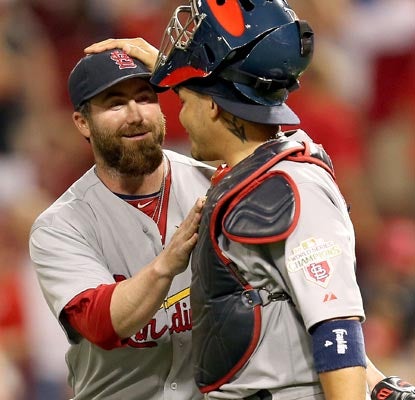 Jason Motte and Yadier Molina celebrate a big win as they begin an important road trip.  (Getty Images)