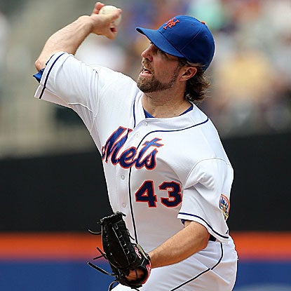 R.A. Dickey throws seven strong innings and also collects an RBI with an infield single in the Mets' win. (Getty Images)