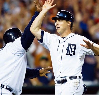 Prince Fielder (left) and Andy Dirks celebrate during a three-run eighth inning that puts the Tigers ahead.  (US Presswire)
