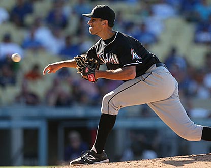 Marlins reliever Steve Cishek gets out Adrian Gonzalez with the bases loaded in the eighth, then earns the save in the ninth. (Getty Images)