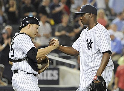 Yankees catcher Russell Martin congratulates closer Rafael Soriano after a 1-2-3 ninth inning for his 34th save.  (AP)