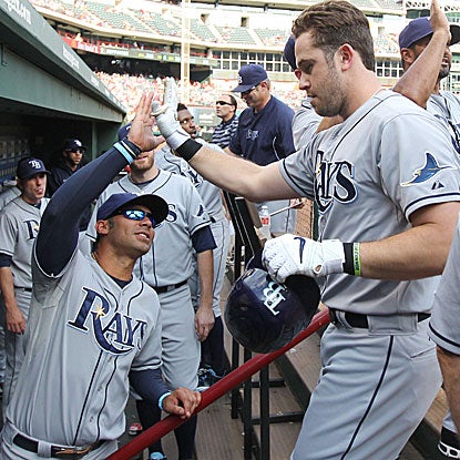 Evan Longoria homers twice, a two-run shot in the first inning and a solo job in the ninth, to help the Rays beat the Rangers. (Getty Images)