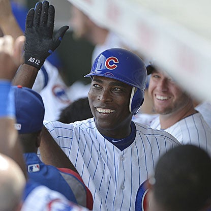 Alfonso Soriano drives in three runs in the Cubs' win, two via a HR that leaves Wrigley Field and lands on Waveland Avenue. (Getty Images)