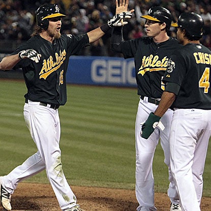 Josh Reddick contributes his first career grand slam to the A's 20-run onslaught, their most runs since they scored 23 in 2000. (US Presswire)