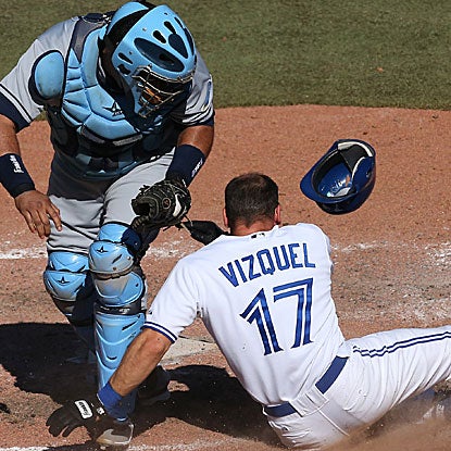 Jose Molina tags out Omar Vizquel for the final out in the Rays' one-run victory over the Blue Jays.  (Getty Images)