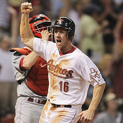 The Astros' Matt Downs hits a pinch-hit double in the ninth inning and then comes around to score the winning run on an error. (Getty Images)