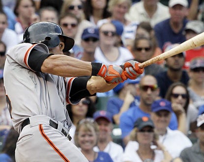 The Giants' Angel Pagan delivers in the ninth inning with a tiebreaking RBI single against the Cubs.  (AP)