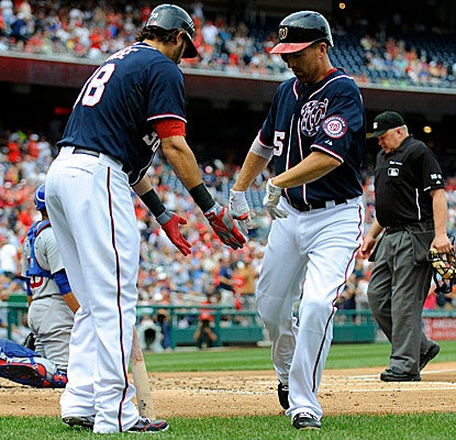 Adam LaRoche heads to the Nats' dugout after cracking his 25th home run of the season to lead off the second inning. (US Presswire)