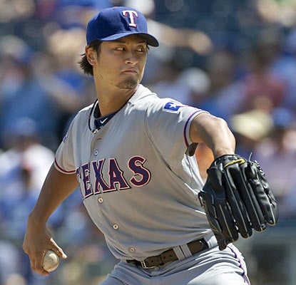 Rookie Yu Darvish pitches seven strong innings and racks up his 14th win of the season. (AP)