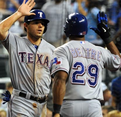 Adrian Beltre is glad to see Ian Kinsler score the game-winning run in the 10th inning for Texas.  (US Presswire)