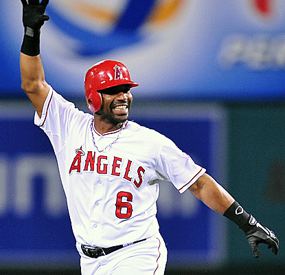 Angels third baseman Alberto Callaspo celebrates after hitting the game-winning single against the Tigers.  (US Presswire)