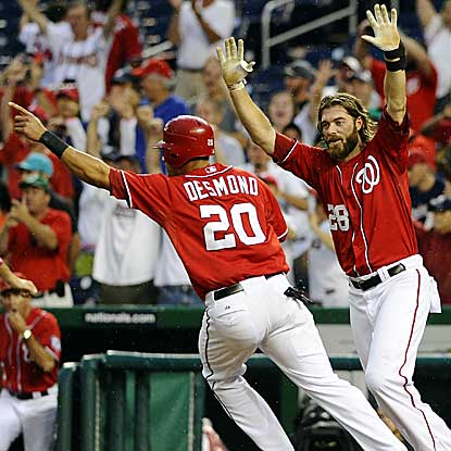 The Nats' Jayson Werth (right) homers in the ninth to tie the game and Corey Brown wins it in the 10th with an RBI single.  (US Presswire)