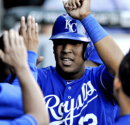 Kansas City's Salvador Perez is congratulated after scoring what would prove to be the winning run in the 10th.  (AP)