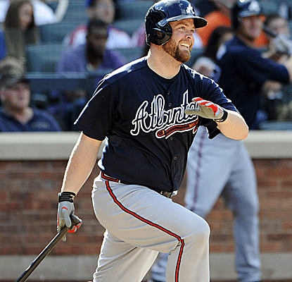 Brian McCann comes up big for the Braves, connecting for a home run while also driving in the winning run.  (AP)